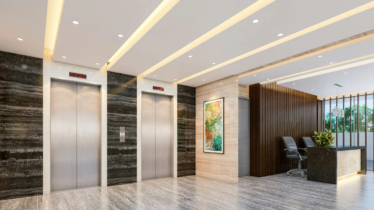 a modern building lobby with a reception desk and lift doors